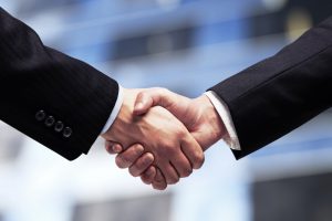 People coming to an agreement by shaking hands